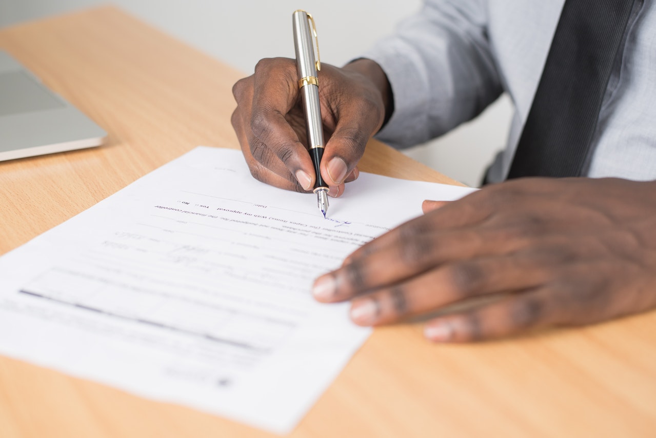 Man signing a cohabitation contract